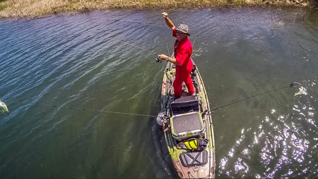 Eric Jackson with a nice bass on the line in his Big Rig Jackson Kayak. 